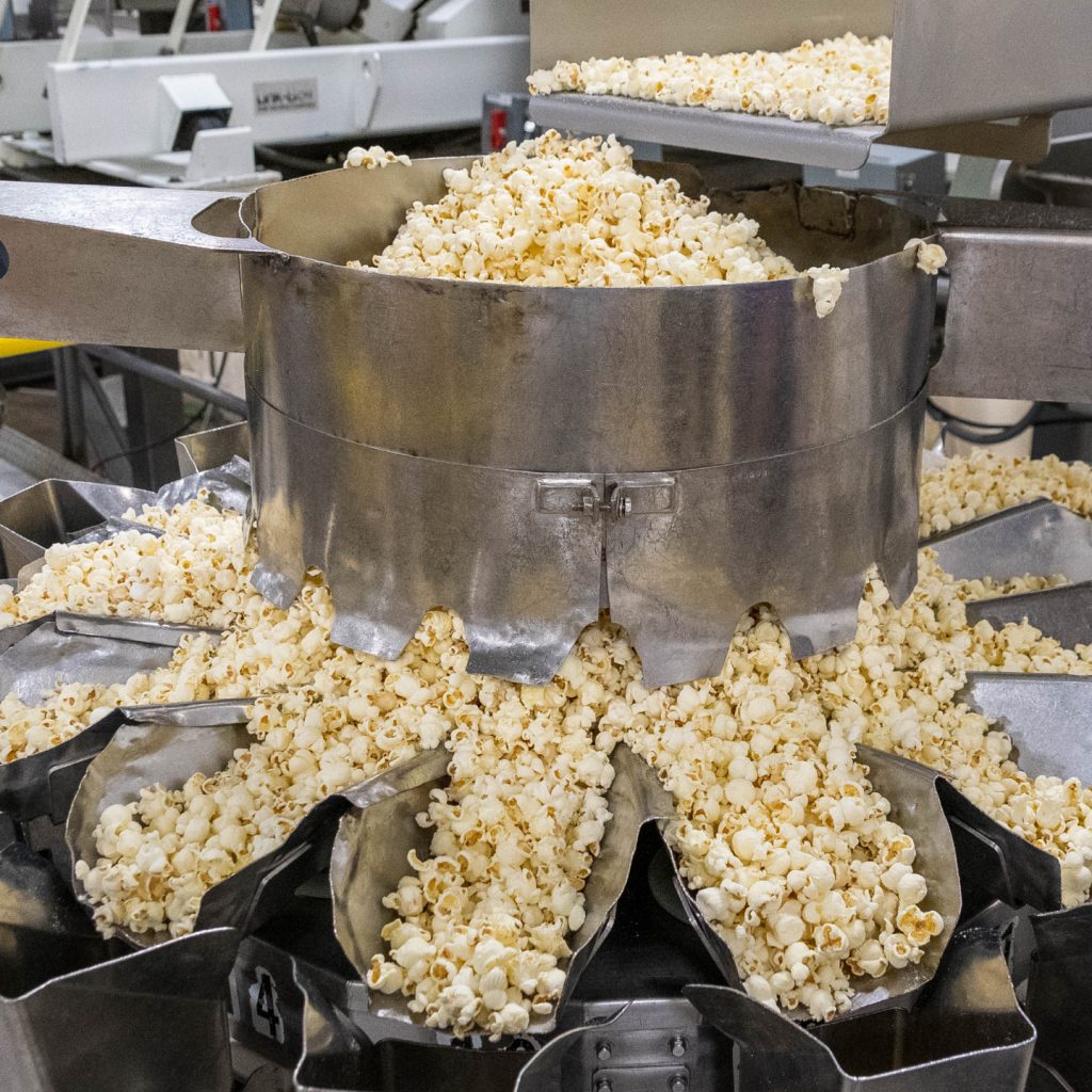Popcorn being dispensed from a machine
