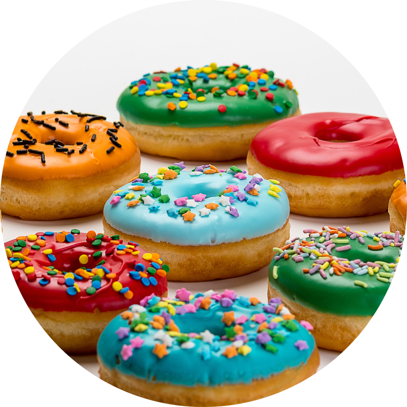 Donuts with coloured frosting and sprinkles