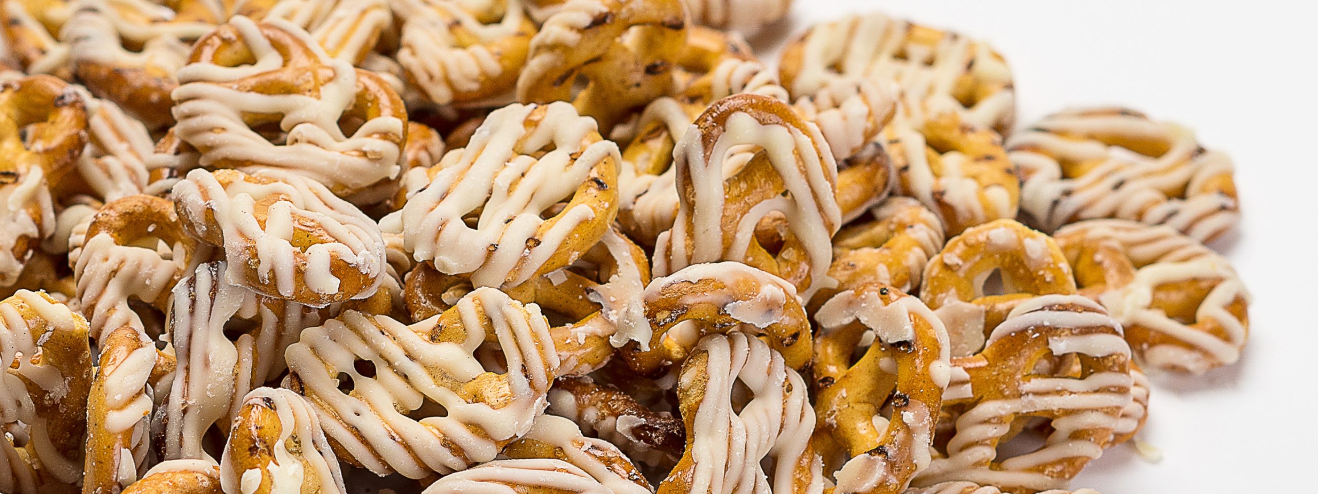 Close up photo of pretzels drizzled with icing